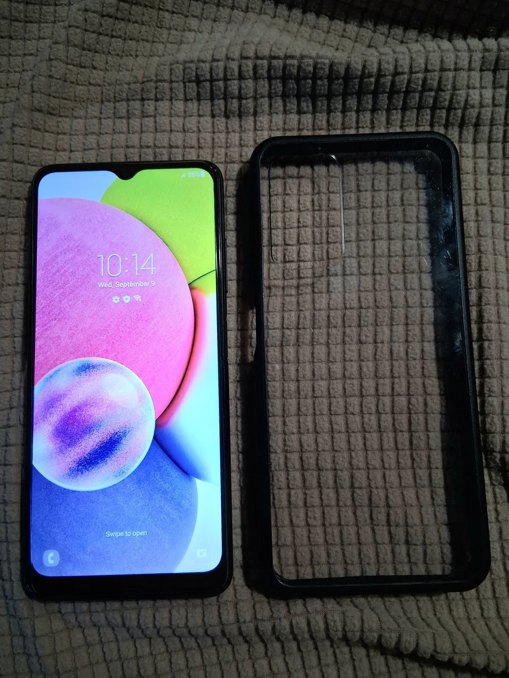 Samsung Galaxy A-Series Smartphone with Black Protective Case